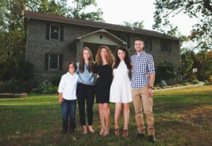 Cara Brookins and her children at their Family House