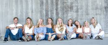 Krista, her husband, and her 7 daughters